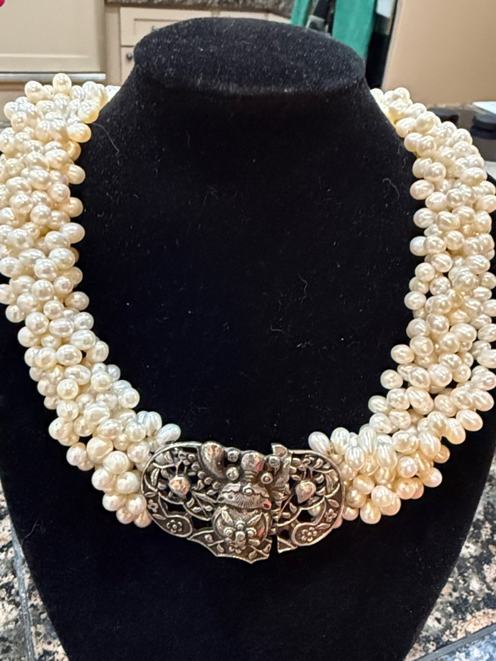 Cream Multi-Strand Pearl Necklace with Ornate Silver-Tone Clasp